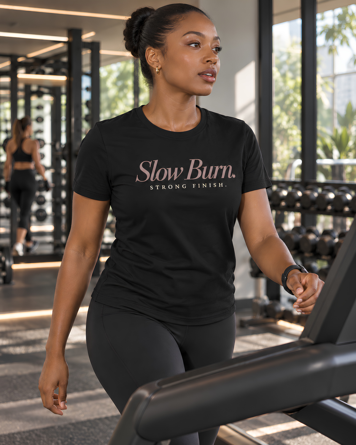 “Slow Burn. Strong Finish.” women's fitness graphic T-shirt styled as a casual workout outfit.