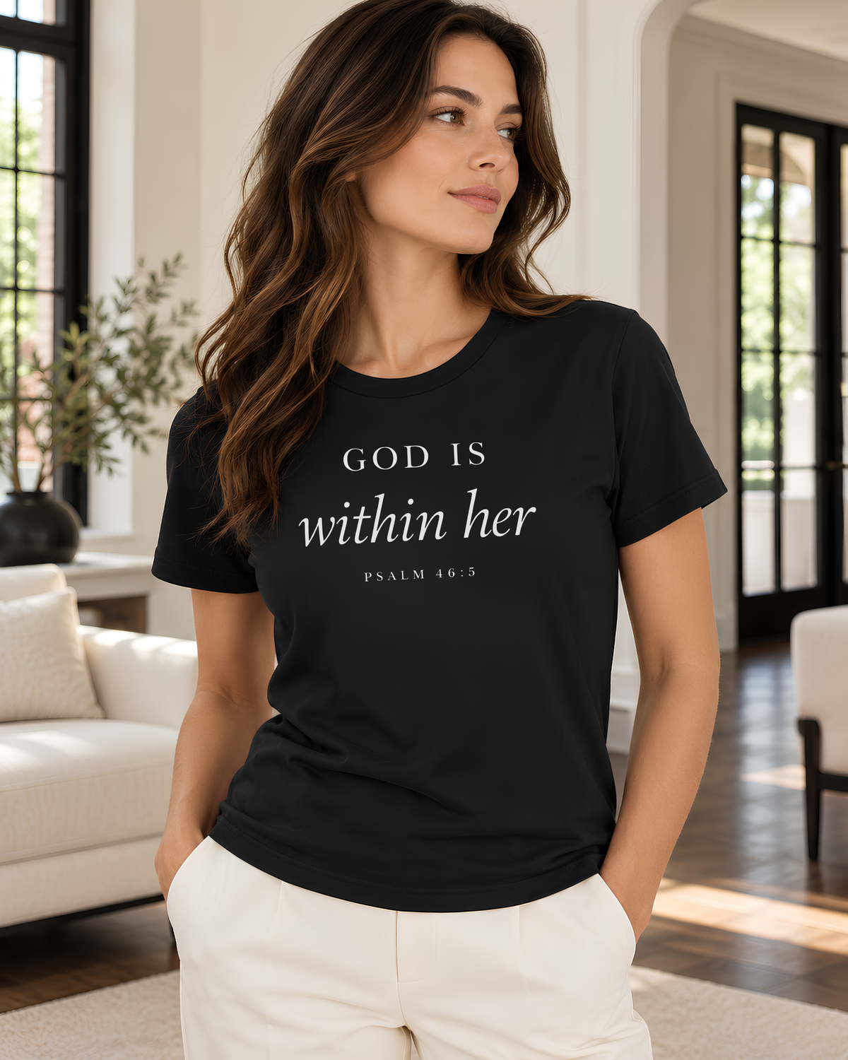 Black God Is Within Her Christian graphic tee for women with light Psalm 46:5 typography across the front.