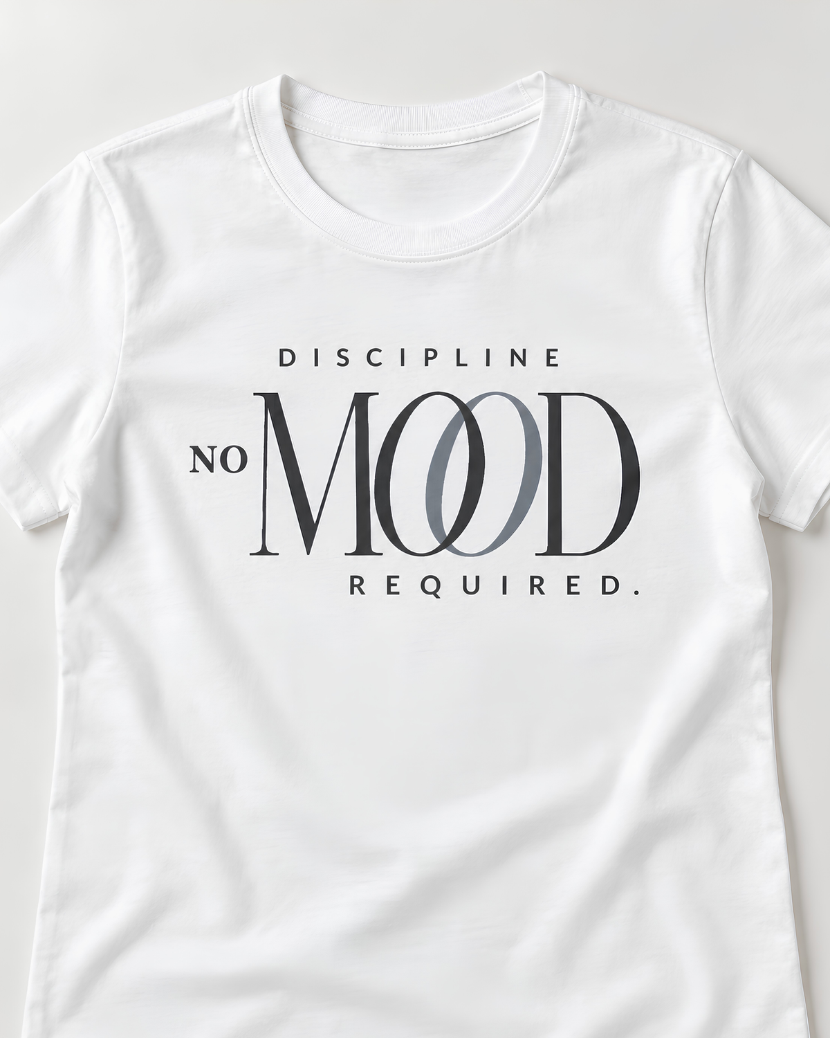 A white short-sleeve workout crewneck t-shirt featuring a graphic print on the front that reads 'DISCIPLINE NO MOOD REQUIRED.' in black and gray lettering.