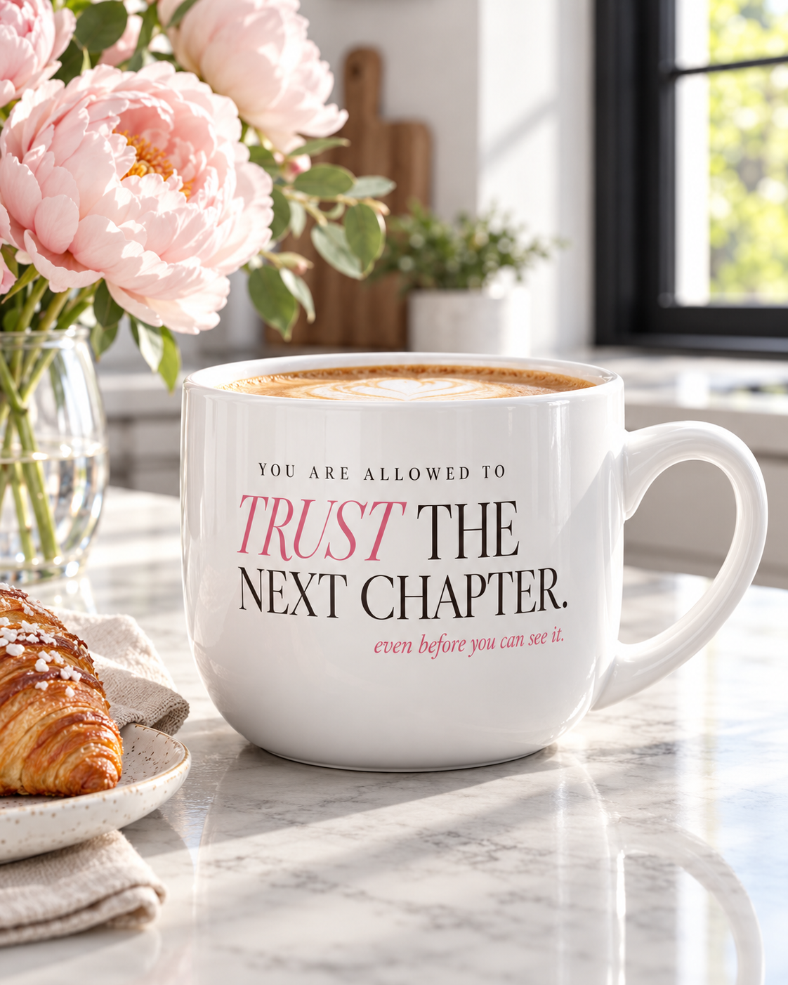 White 25 oz ceramic coffee mug with “You Are Allowed to Trust the Next Chapter” in pink editorial lettering.
