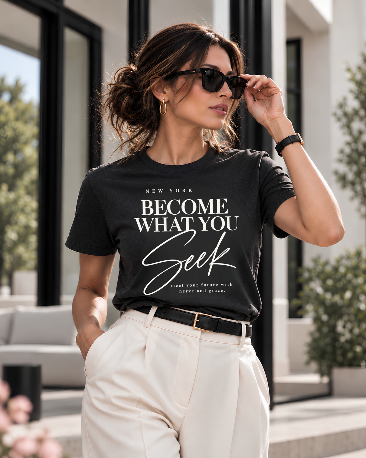 Woman wearing a coal New York Become What You Seek graphic tee