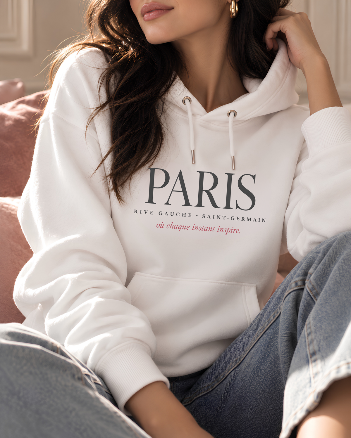 Living Redesigned women’s graphic hoodie styled in a refined fashion setting.