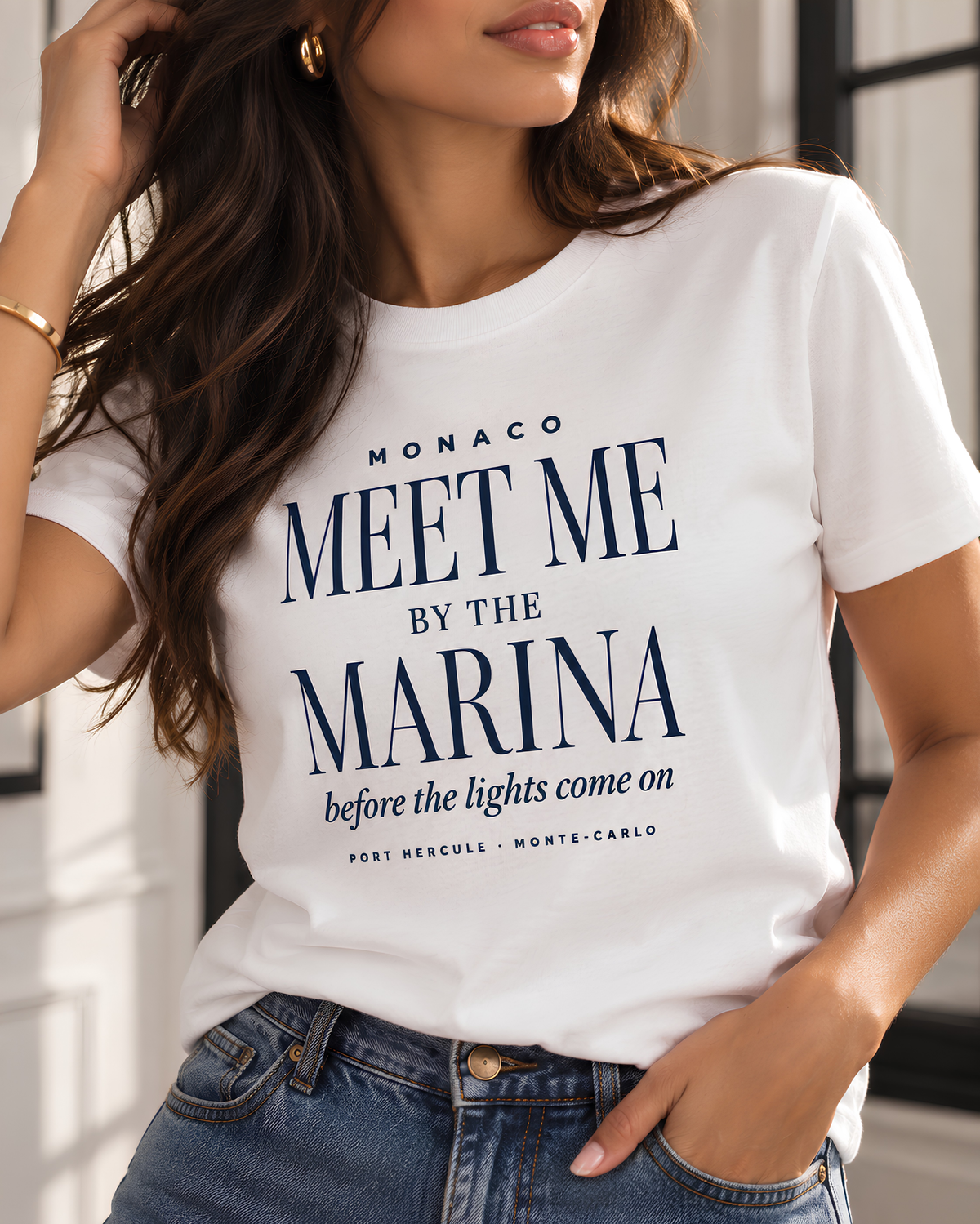 Living Redesigned women’s graphic tee styled in a refined fashion setting.